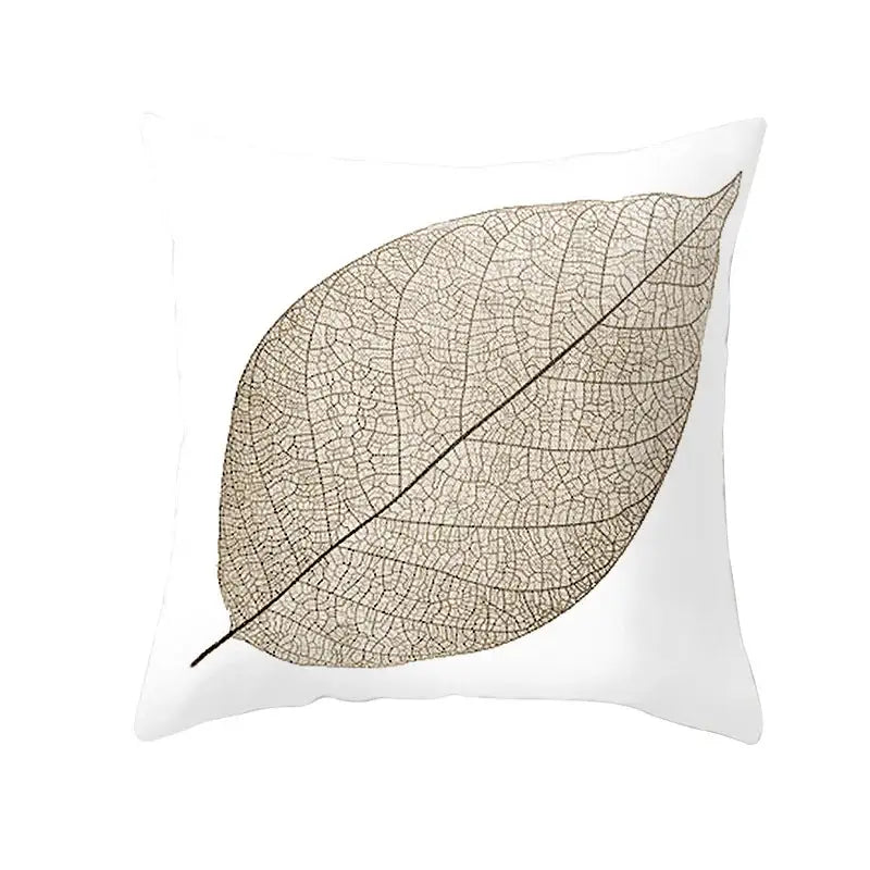 White throw pillow with detailed beige leaf silhouette featuring intricate vein patterns for autumn maple leaves decor