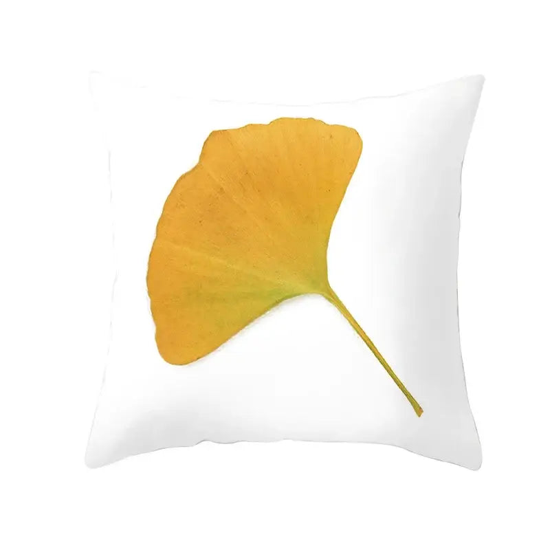 White throw pillow with golden-yellow ginkgo leaf print for botanical autumn maple leaves living room decor