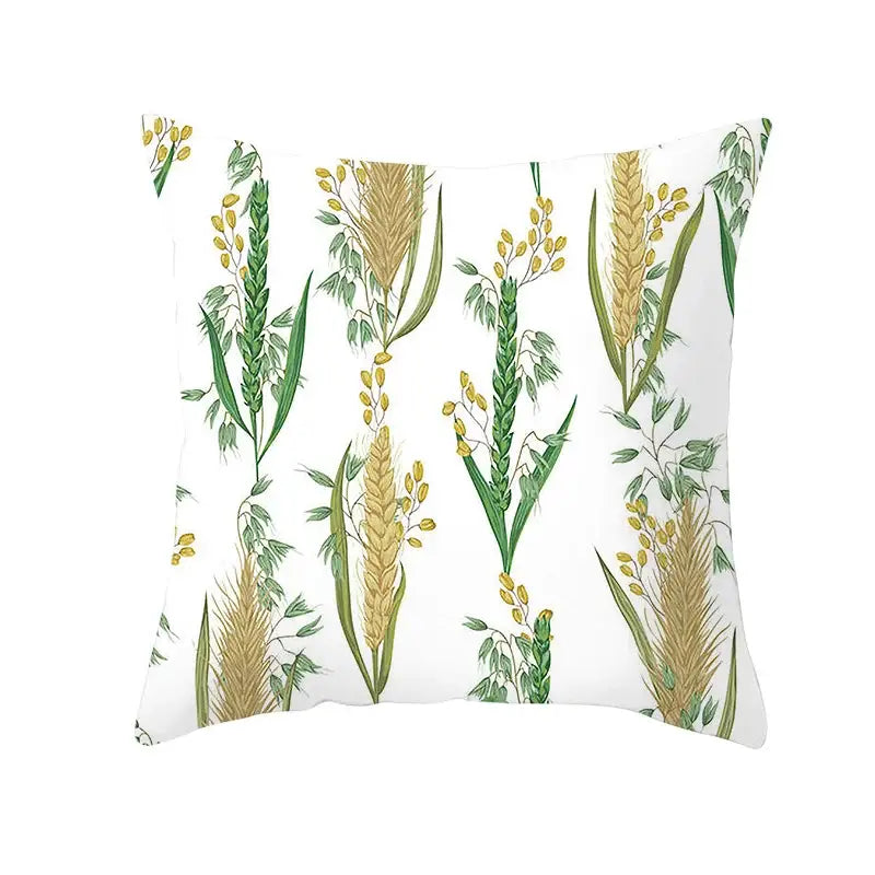 White throw pillow featuring botanical autumn maple leaves and green golden cereal stalks for living room decor