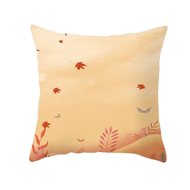 A square plush pillow case with autumn maple leaves and butterflies on a soft peach background for living room decor