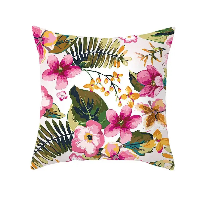 A square plush pillow case with vibrant tropical floral pattern in pink yellow and green for autumn maple leaves decor