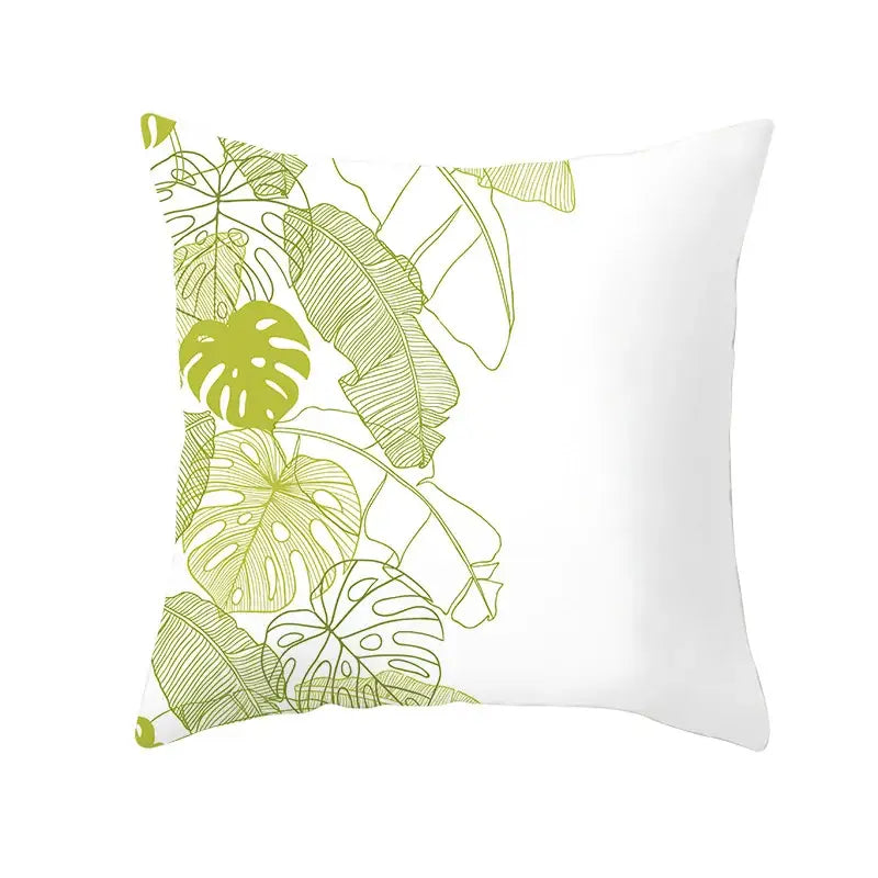 White throw pillow with vibrant lime green tropical leaf pattern featuring detailed line art for autumn maple leaves decor