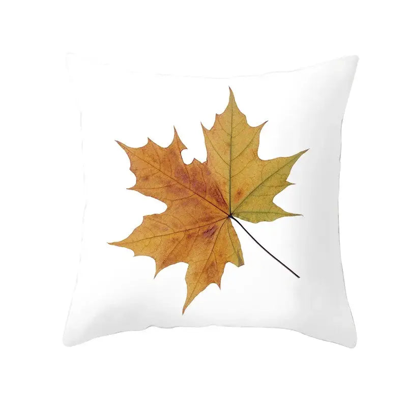 White throw pillow with detailed print of golden-yellow autumn maple leaves for living room decor