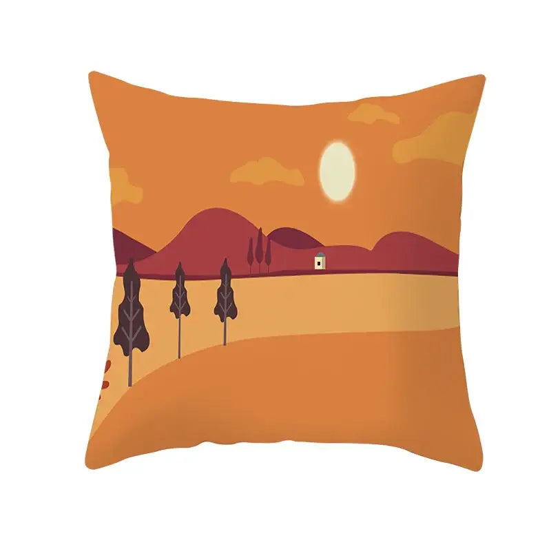 Orange throw pillow featuring a stylized sunset with purple mountains and dark trees for autumn maple leaves decor