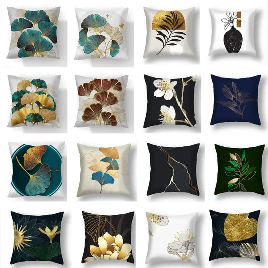 Decorative living room cushion covers featuring big leaves botanical prints in gold teal navy and cream colors