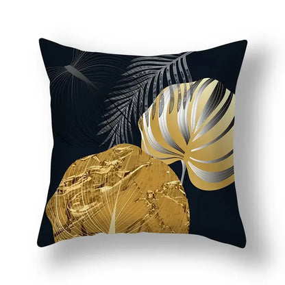 Black throw pillow with bold metallic gold and silver tropical big leaves design for living room cushion covers
