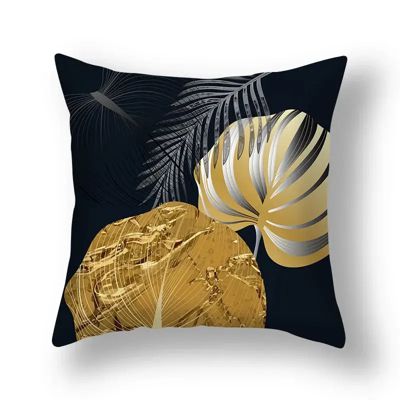Black throw pillow with bold metallic gold and silver tropical big leaves design for living room cushion covers