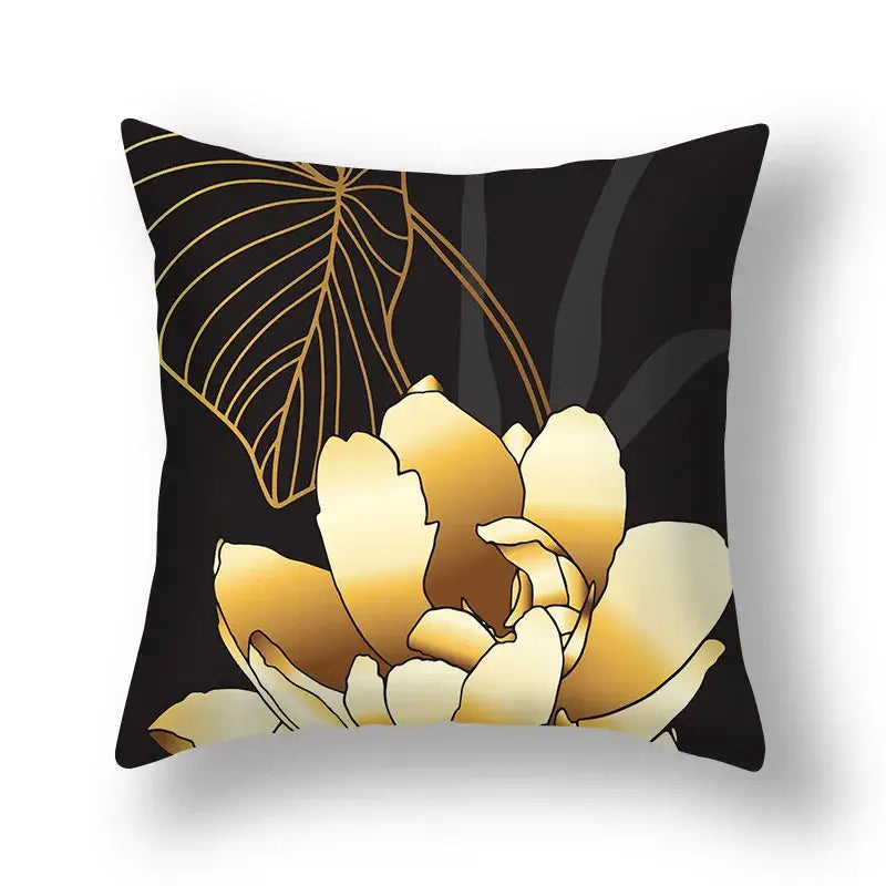 Black cushion cover with gold-toned big leaves floral design featuring delicate leaf outlines for living room decor