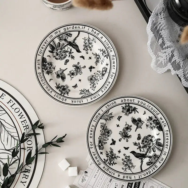 White ceramic black bird ceramic coffee cup and saucer set with intricate floral illustrations and poetic border decorbites black bird