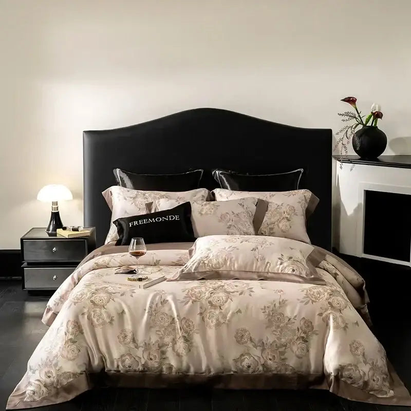 Elegant beige floral satin bedding set with gold embroidery and black freemonde pillow in botanical cream egyptian cotton print
