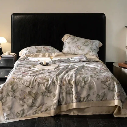 Elegant beige silk duvet cover with delicate leaf pattern and satin trim in botanical ivory eucalyptus fiber quilt set