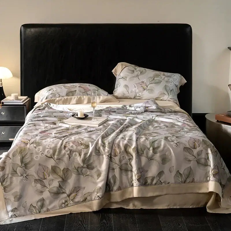 Elegant beige silk duvet cover with delicate leaf pattern and satin trim in botanical ivory eucalyptus fiber quilt set