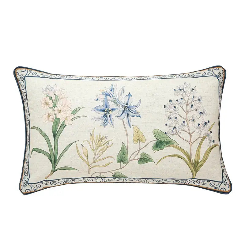 Beige linen lumbar pillowcase with embroidered botanical leaf watercolor design and blue scrollwork border for bedroom decor