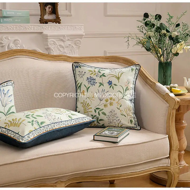 Beige upholstered sofa with botanical leaf watercolor linen lumbar pillowcase featuring navy blue piping for bedroom decor