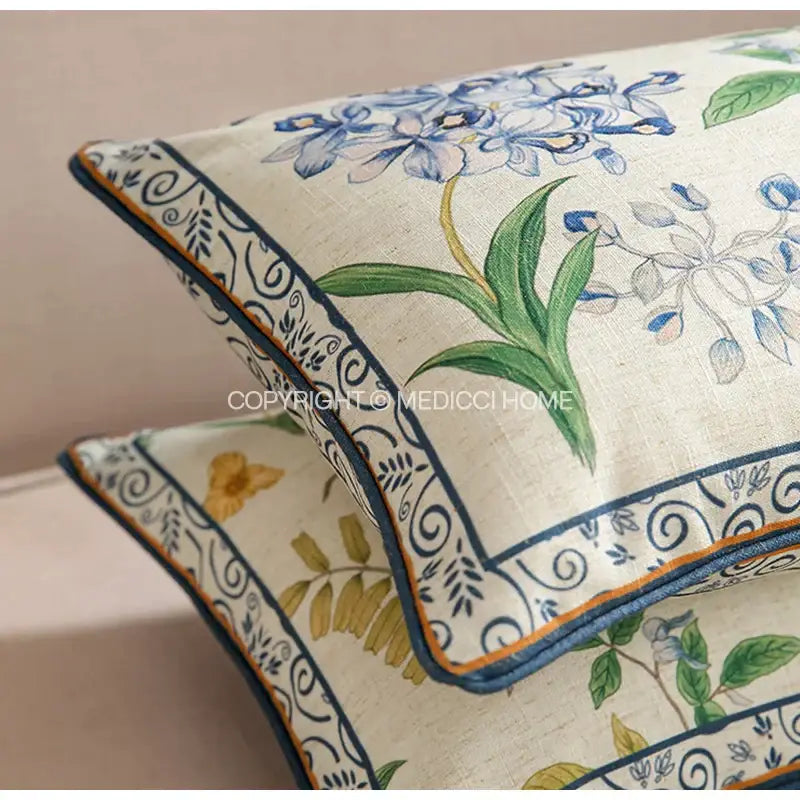 Beige linen botanical leaf watercolor lumbar pillowcase with blue green floral embroidery and navy orange piping