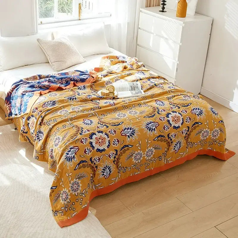 Vibrant mustard-yellow decorbites cotton leisure blanket with navy blue floral patterns for bedroom use
