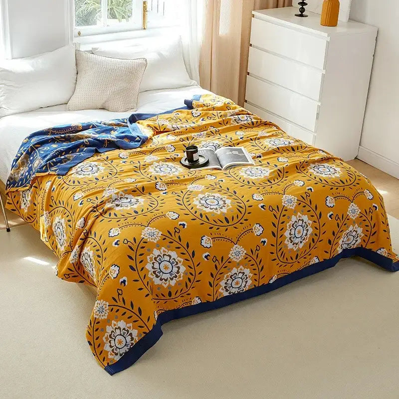 Vibrant yellow decorbites cotton leisure blanket with intricate floral patterns and navy border for bedroom use