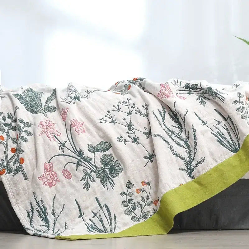 Off-white decorbites cotton leisure blanket with delicate pink green botanical print and vibrant lime green border