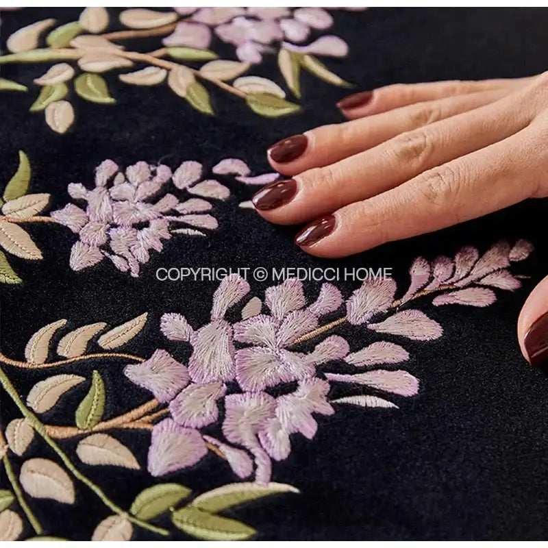 Black velvet cushion cover with intricate botanical wisteria embroidered lavender and green floral design decorbites