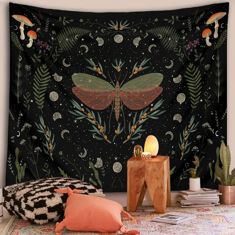 Black botanical witchy tapestry with central moth green and reddish wings surrounded by mushrooms ferns moons stars and vines