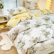 Yellow and white floral duvet cover set with green and gold botanical prints for bedroom bedding