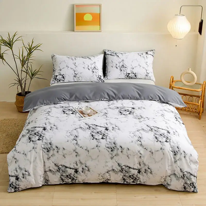 White and black marble-patterned duvet cover set with solid gray inner lining from botanical yellow and white floral cover set