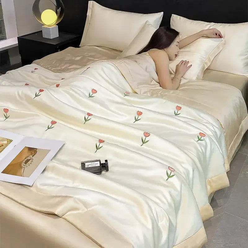 Cream-colored satin duvet cover with delicate pink tulip embroidery in decorbites bowknot embroidered summer bedding set