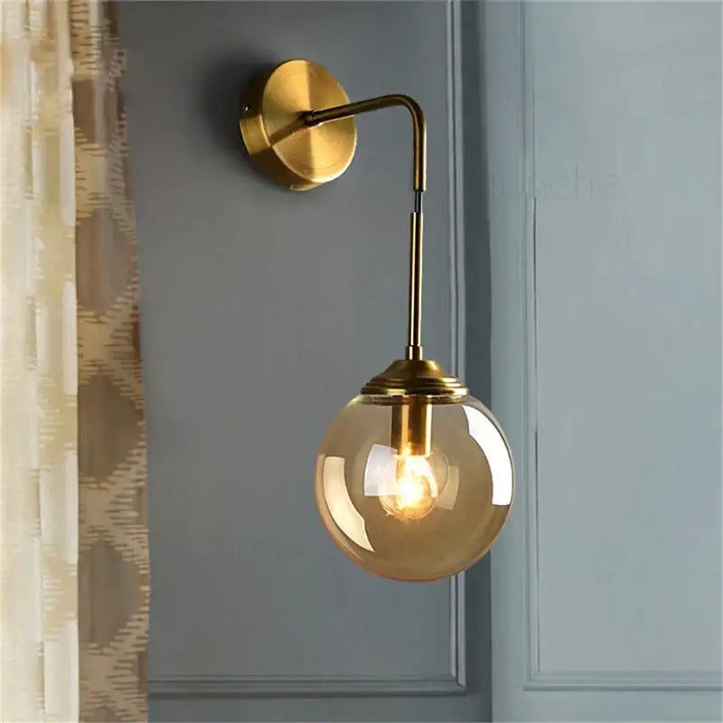 Brass amber glass ball wall light with spherical amber glass globe for bedroom and living room decorbites glass ball
