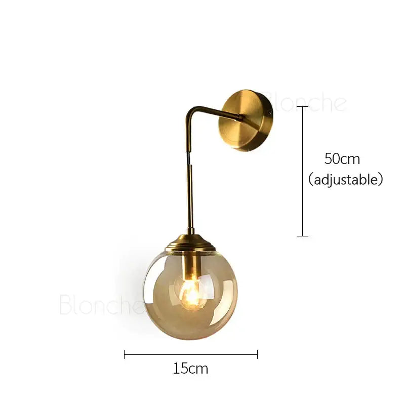 Brass amber glass ball wall light with a sleek brass finish and spherical amber decorbites glass ball for bedroom and living room