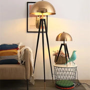 Brass and black decorbites coyote gold tripod floor lamp with brass dome shade and warm glowing light for living room decor