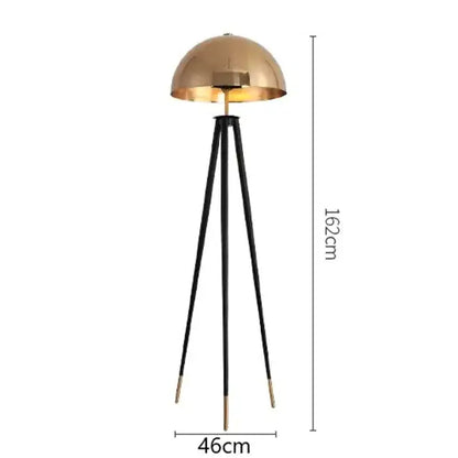 A sleek 162cm brass and black coyote gold tripod floor lamp with polished dome shade for living room decorbites coyote gold