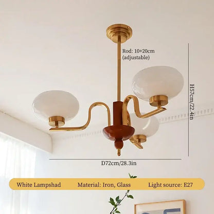 Vintage-style brass and wood glass pendant chandelier with cream glass lampshades for dining room decorbites cream glass