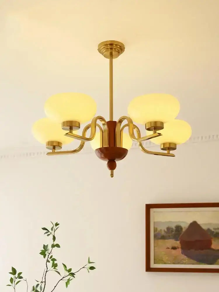 Brass and cream glass pendant chandelier with frosted shades five-light design for dining room decorbites cream glass