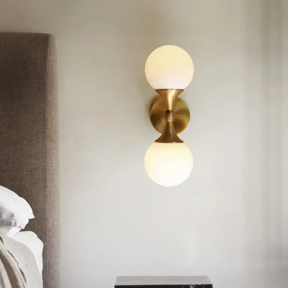 DecorBites ivory glass ball wall lamp with two head brass sconce features gold-toned wall lamp with frosted globe shades