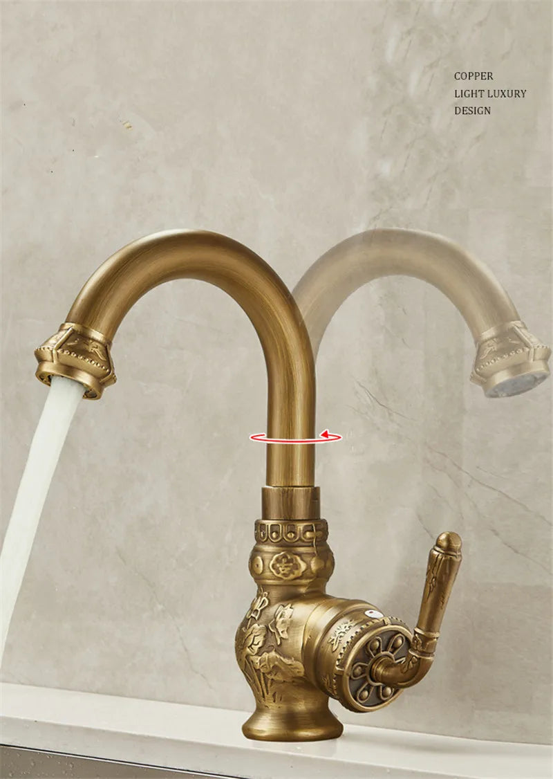 Antique bathroom sink faucet in brass finish featuring ornate floral and scrollwork detailing on copper material