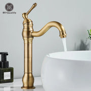 Antique brass-finished single-handle brass bathroom basin mixer faucet with curved spout and decorative ridged body