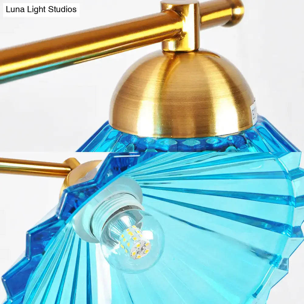 Decorbites blue ribbed glass cone pendant light with brass-finished metal frame for traditional dining room use