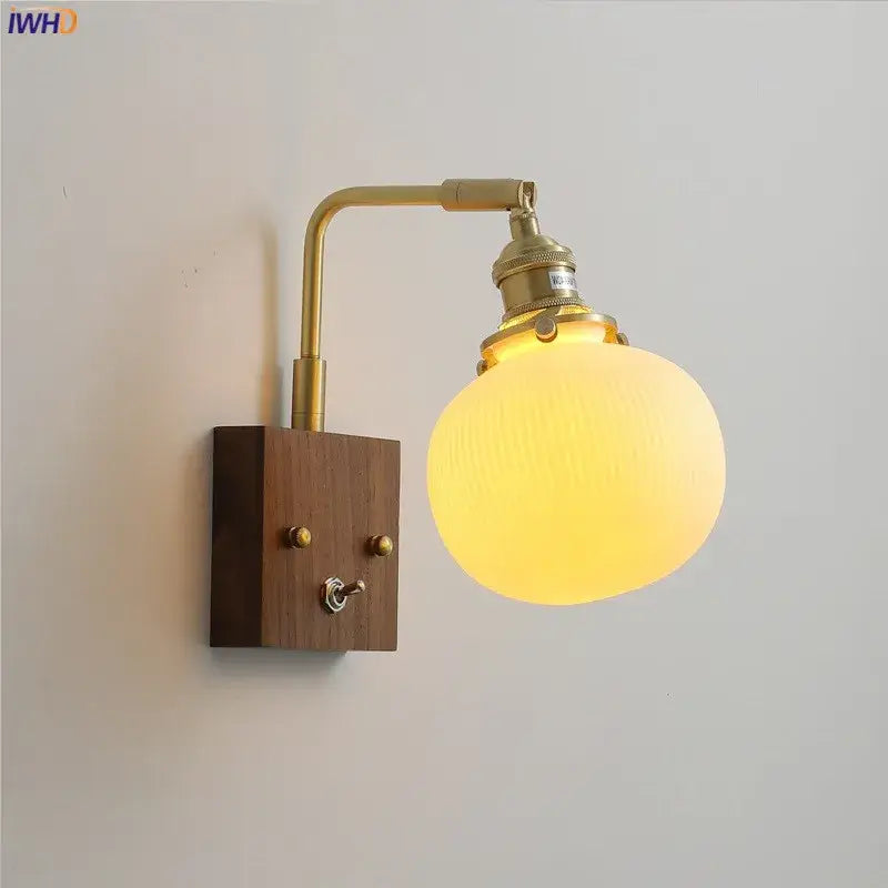 Brass ceramic ball led wall light with textured yellow glass globe and wooden base with toggle switch for living room wall light