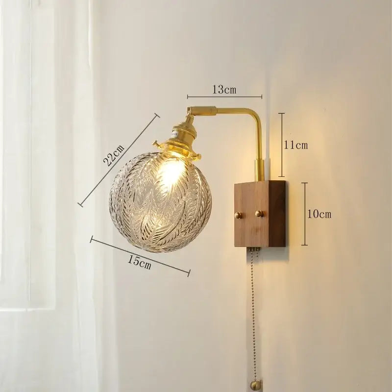 A vintage brass ceramic led wall light with wooden base and yellow globe for elegant living room lighting