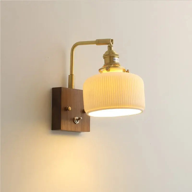 Brass ceramic ball led wall light with yellow globe features ribbed off-white glass shade and wooden mounting plate wall light