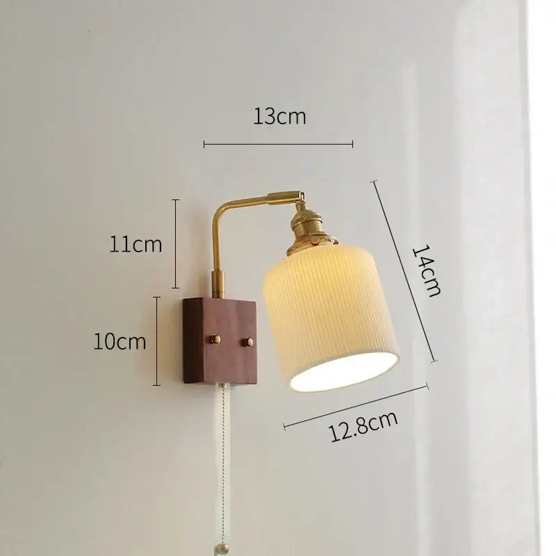 Vintage-style brass wall light with ceramic ball, wooden base, and cream ribbed fabric shade for living room led wall light