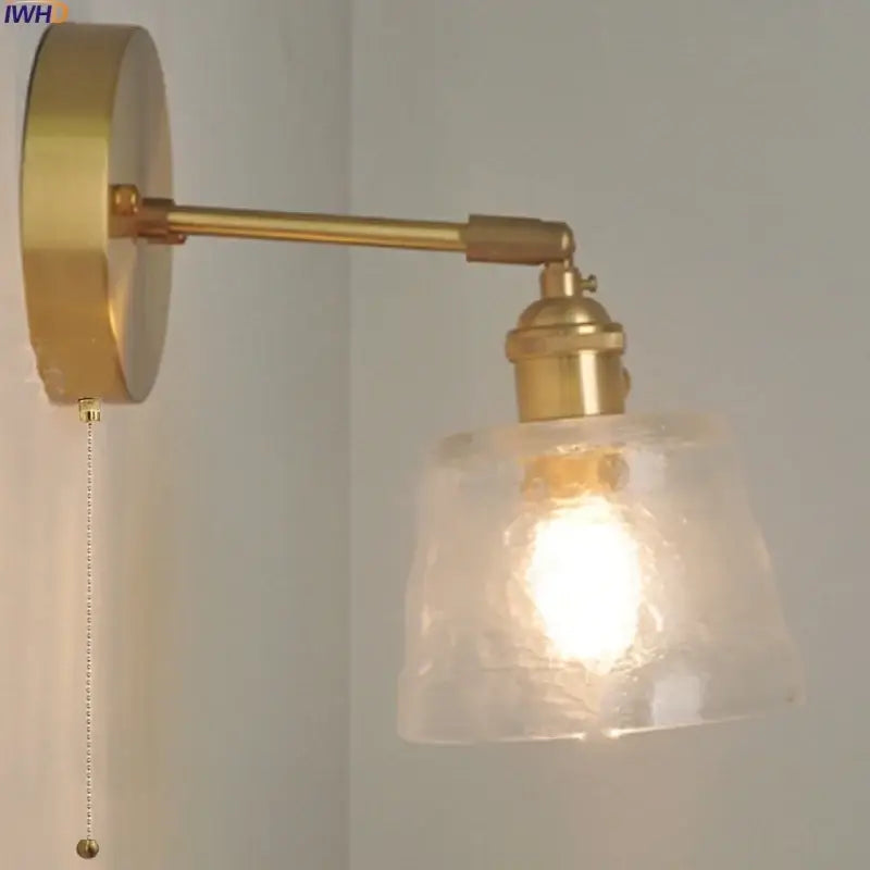 Brass-finished clear glass led wall sconce with textured shade and pull chain for bedroom decorbites clear glass lighting