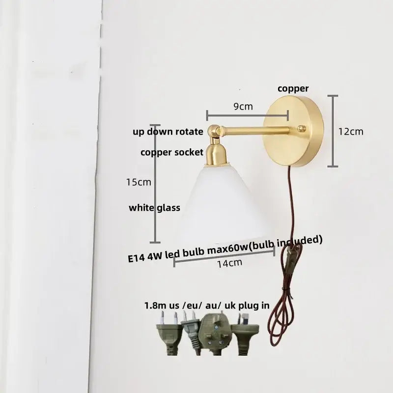 A sleek copper wall light with clear glass shade and up-down rotating socket for bedroom reading decorbites clear glass
