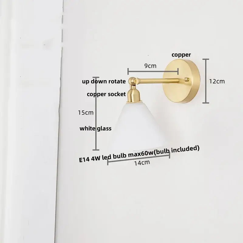 A sleek copper wall light with clear glass shade and up-down rotating socket for bedroom reading decorbites clear glass