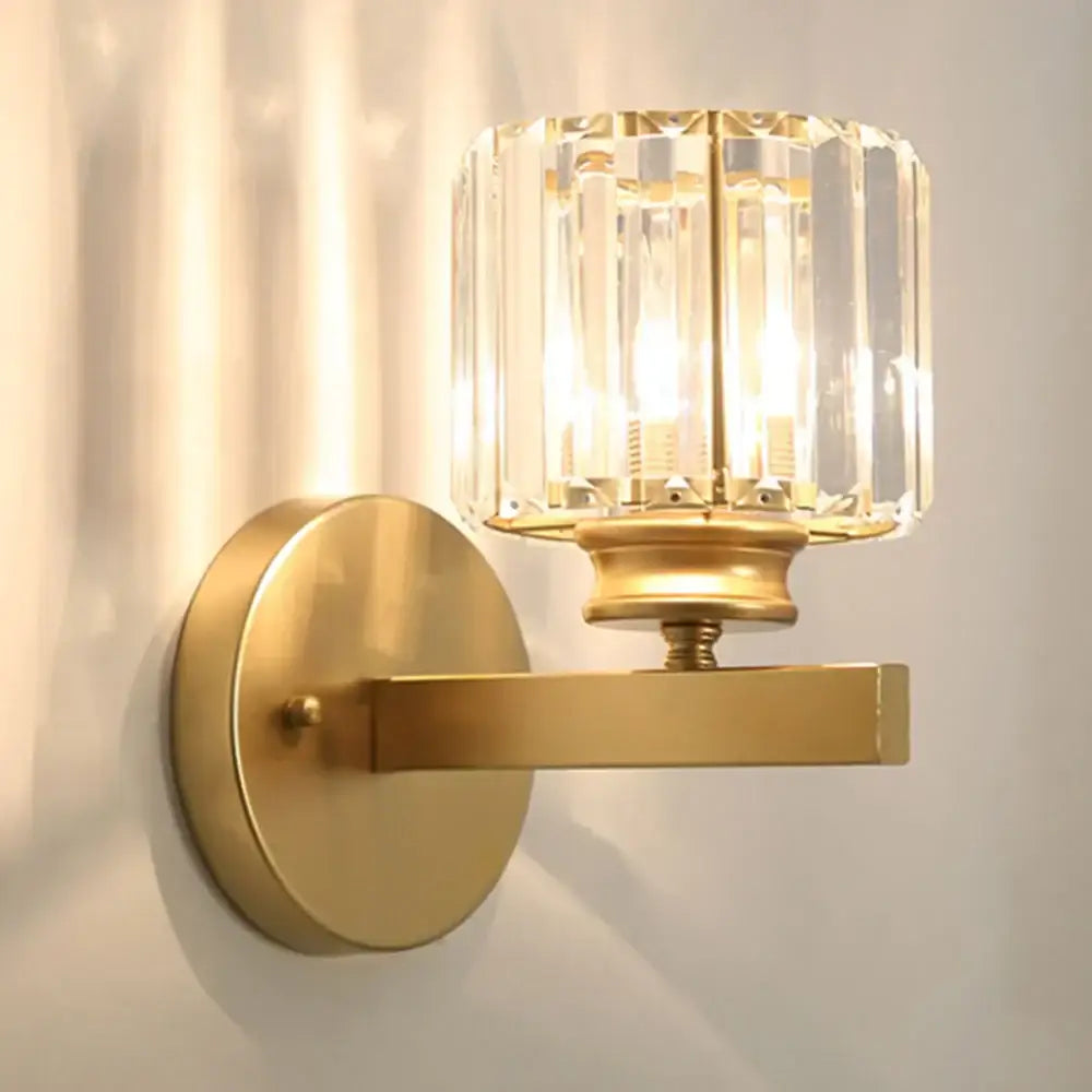 Brass wall sconce with faceted decorbites crystal glass shade for elegant bedroom lighting and crystal glass wall decor