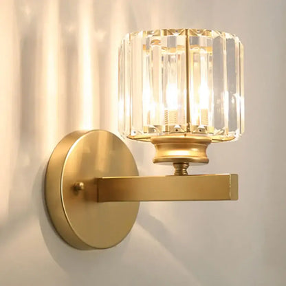 Brass wall sconce with faceted decorbites crystal glass shade for elegant bedroom lighting and crystal glass wall decor