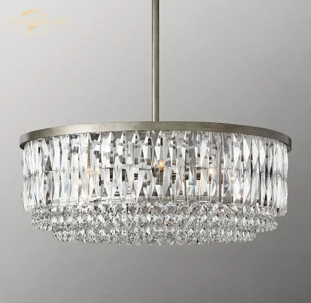 A modern brass decorbites crystal round pendant chandelier with clear prisms for elegant dining room lighting