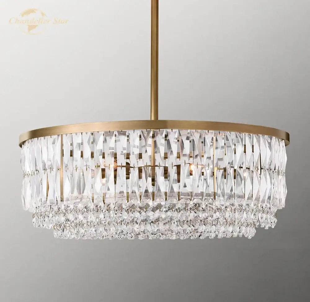 A modern decorbites crystal round pendant chandelier with gold brass frame and clear faceted glass prisms for dining room