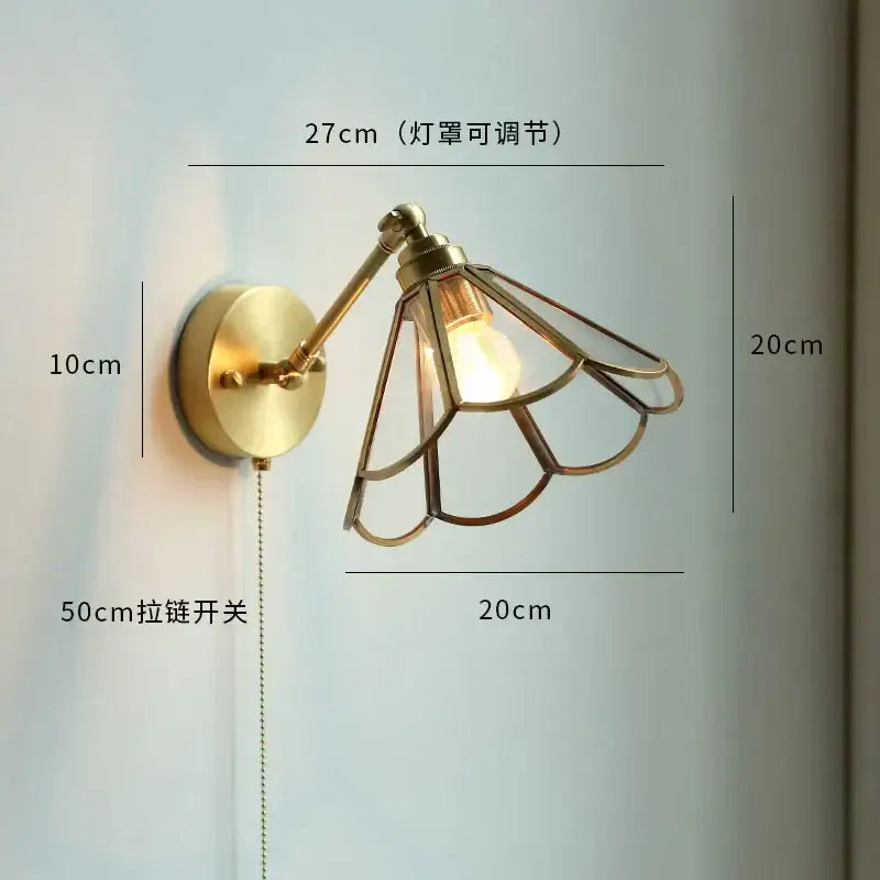 Brass-finished adjustable copper led wall sconce with glass petal-shaped shade and pull chain for bedroom mirror