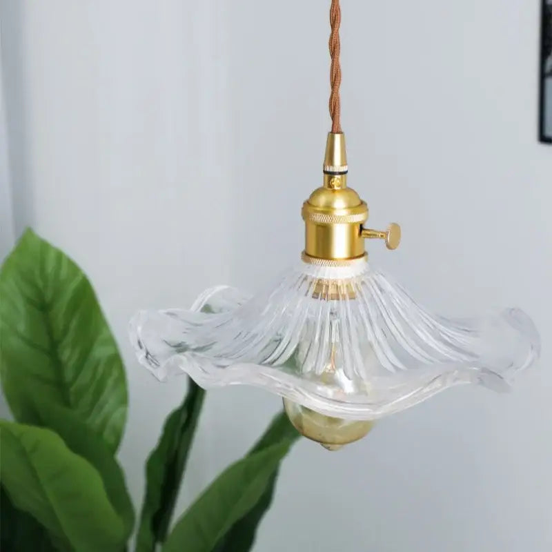 Clear fluted glass pendant lamp with brass glass lotus metal fixture and twisted brown cord for dining room decorbites brass glass